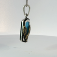 Load image into Gallery viewer, Silver Pendant Featuring Emerald Cut Blue Turquoise Gemstone with Plated Yellow Gold Eagle Design
