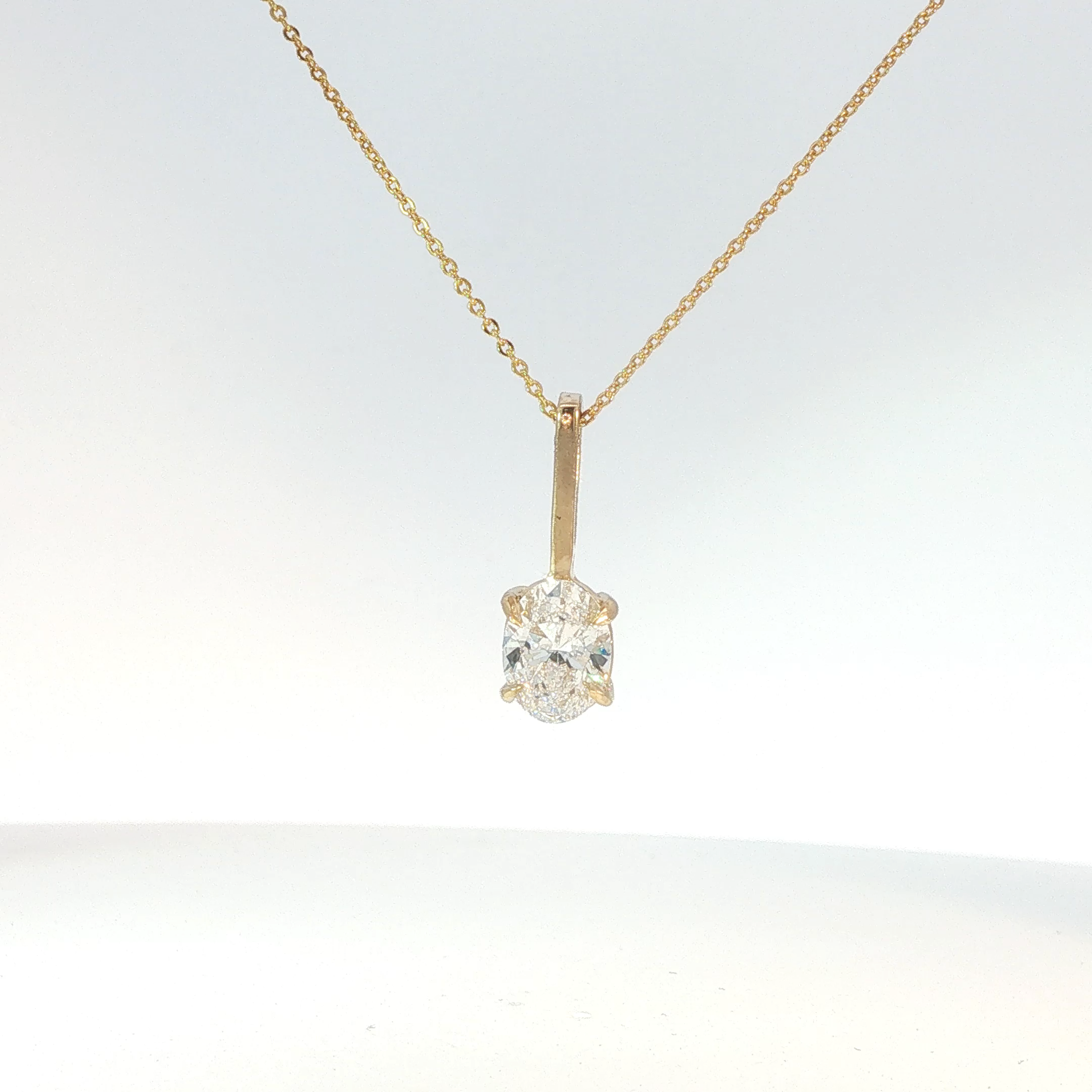 Oval Cut Diamond Pendant Necklace in Yellow Gold