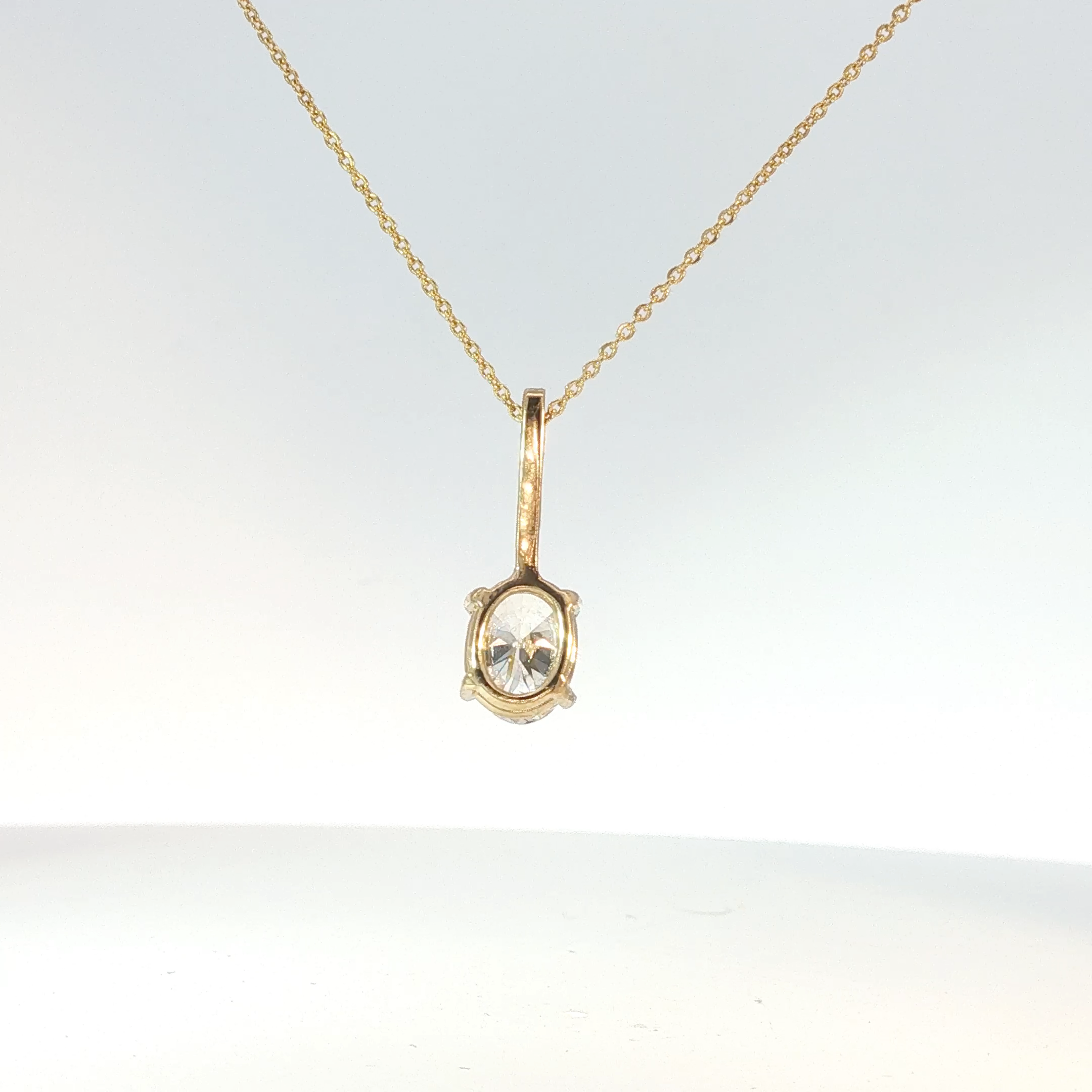 Oval Cut Diamond Pendant Necklace in Yellow Gold