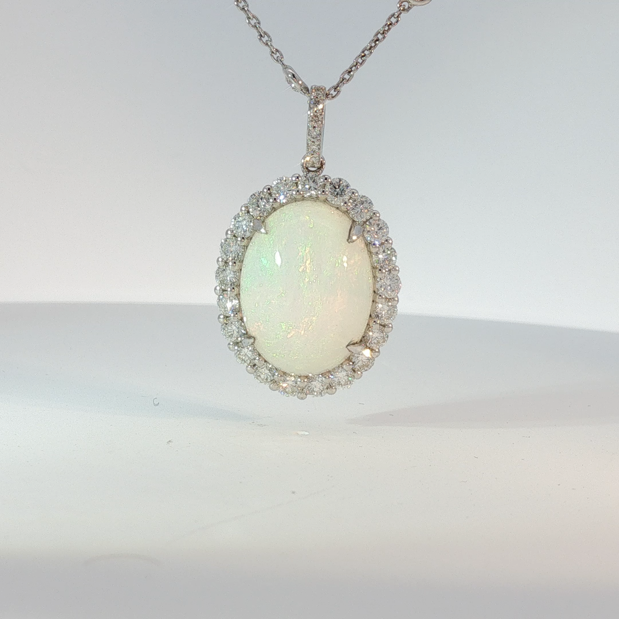 Oval Opal Halo Pendant Necklace in White Gold