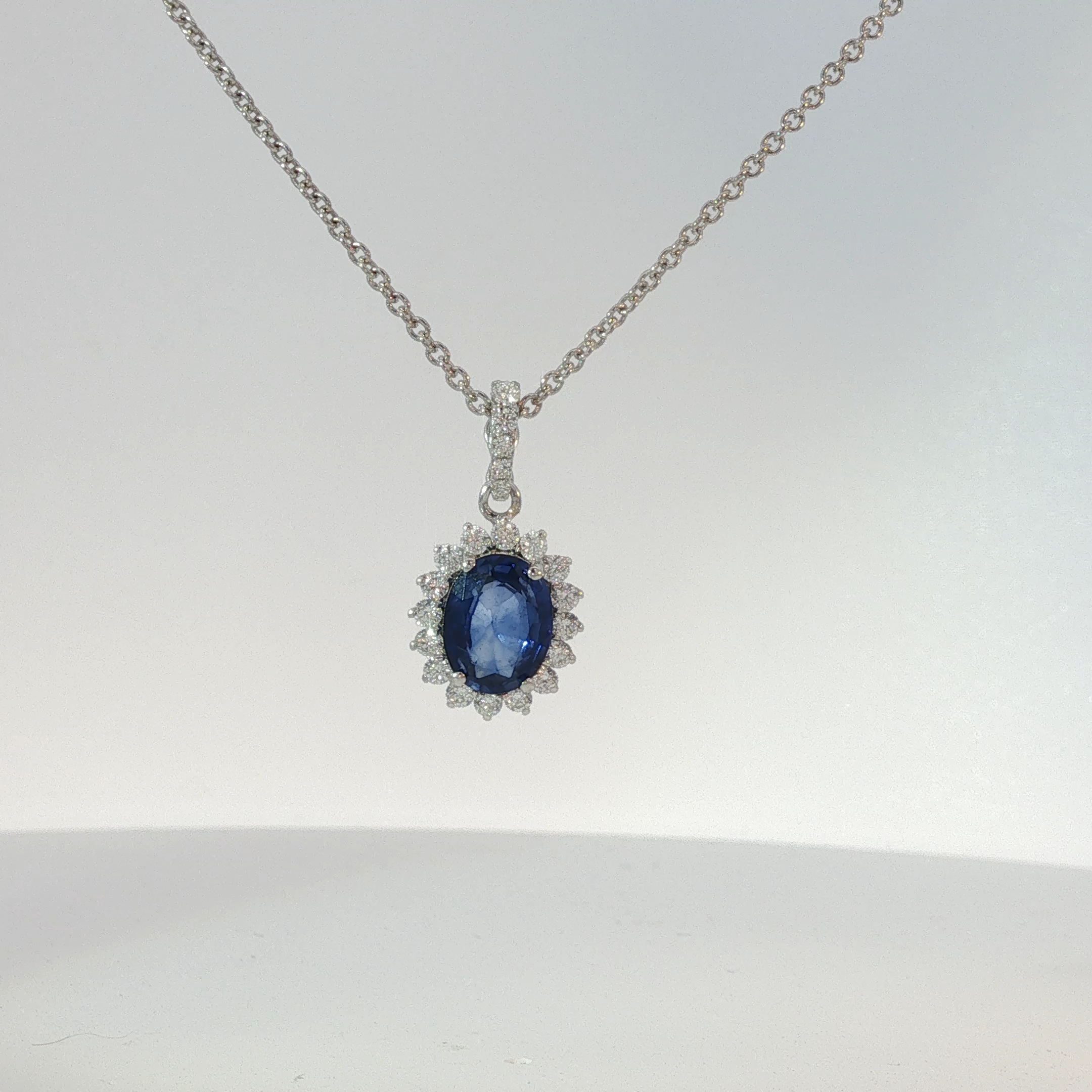 White Gold Royal Blue Sapphire Halo Pendant Necklace