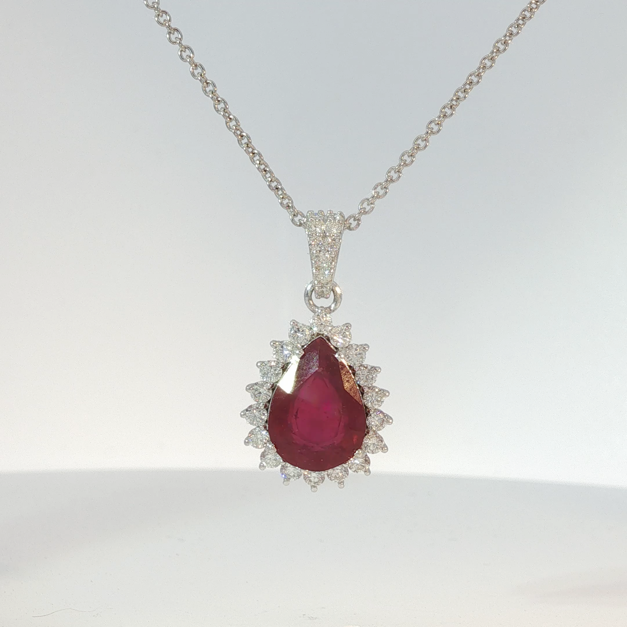 Pear-Shaped Pigeon Blood Ruby Halo Pendant in White Gold