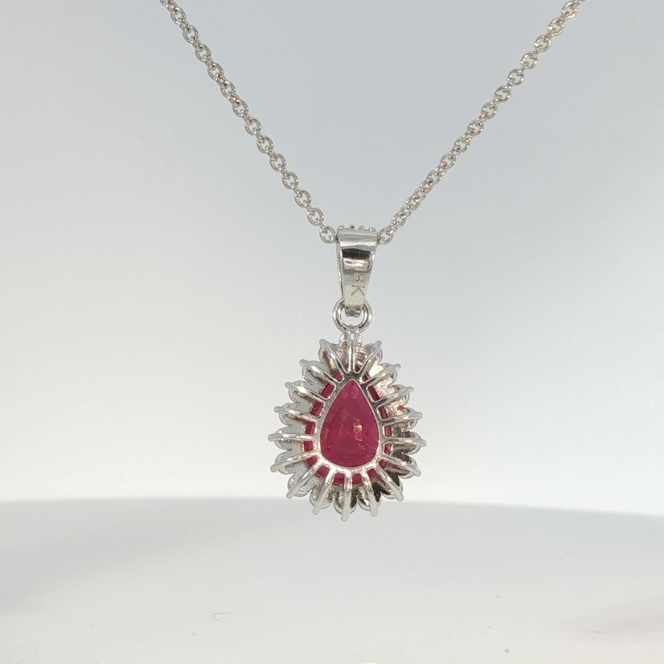 Pear-Shaped Pigeon Blood Ruby Halo Pendant in White Gold