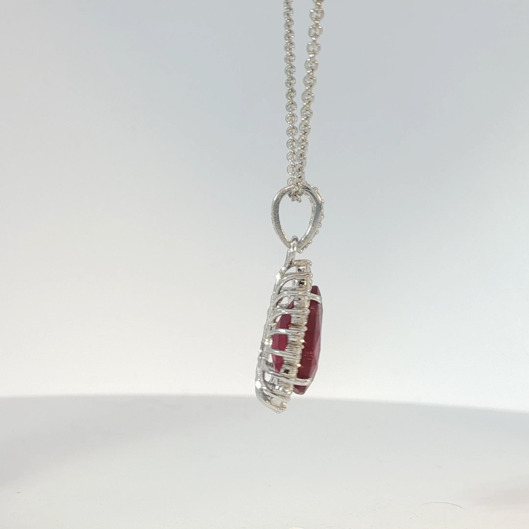 Pear-Shaped Pigeon Blood Ruby Halo Pendant in White Gold