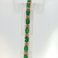 Load image into Gallery viewer, Oval Emerald Tennis Bracelet in Yellow Gold
