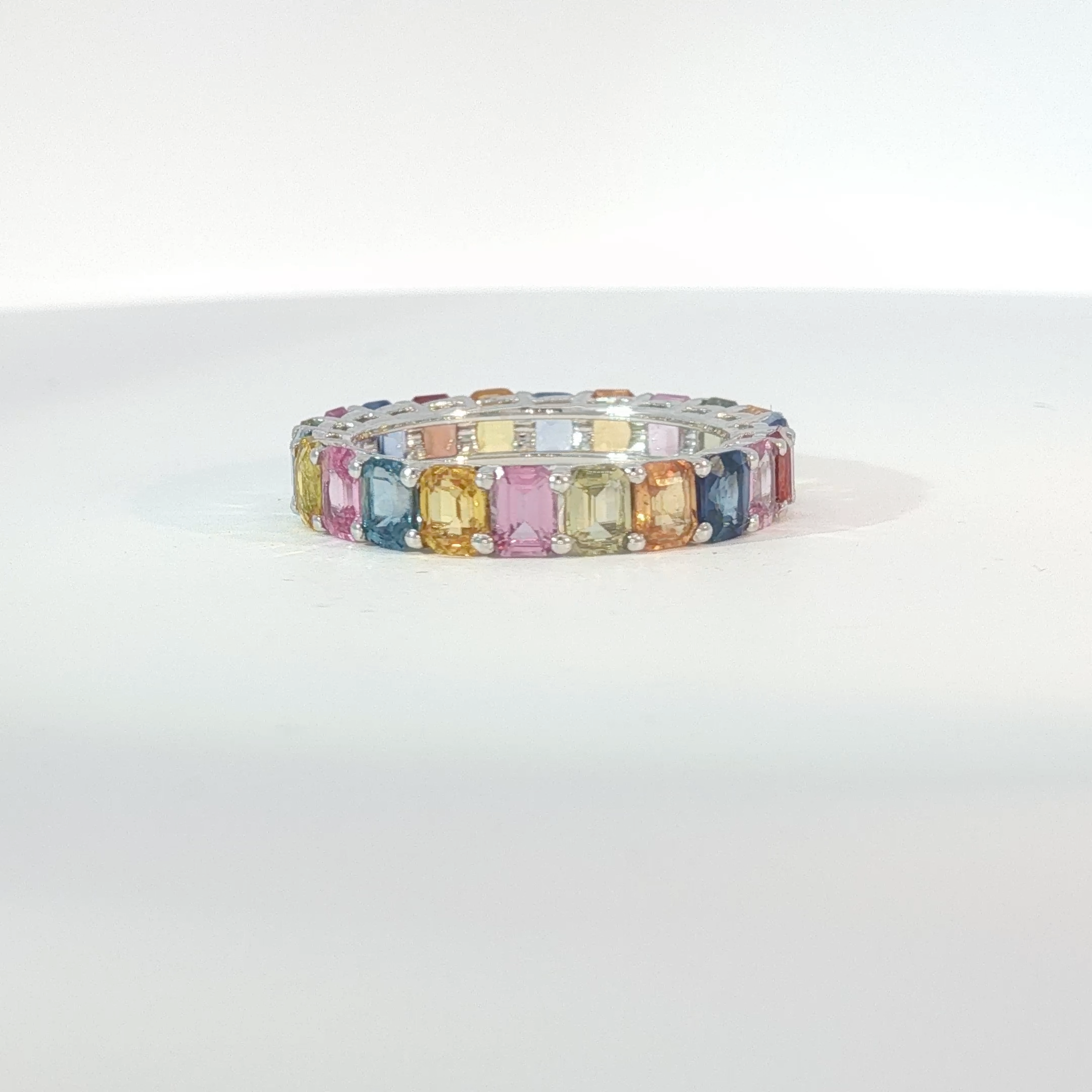 Multi-Color Sapphire Emerald Cut Eternity Ring in White Gold