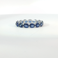 Load image into Gallery viewer, Oval Royal Blue Sapphire White Gold Eternity Ring
