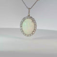 Load and play video in Gallery viewer, Oval Opal Halo Pendant Necklace in White Gold
