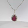 Load and play video in Gallery viewer, Pear-Shaped Pigeon Blood Ruby Halo Pendant in White Gold
