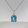 Load and play video in Gallery viewer, White Gold Bezel-Set Blue Topaz Pendant
