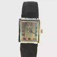 Load and play video in Gallery viewer, 18K Patek Philippe Genève Watch with Roman Numerals and Textured Black Strap
