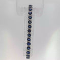 Load and play video in Gallery viewer, Oval Royal Blue Sapphire White Gold Tennis Bracelet
