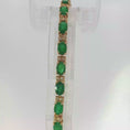 Load and play video in Gallery viewer, Oval Emerald Tennis Bracelet in Yellow Gold
